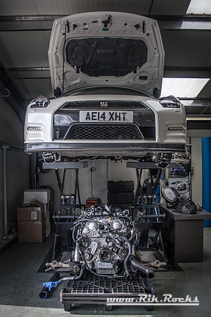 A White Nissan GTR R35 with its engine