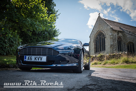 A Dark Blue Aston Martin DB9 on The Cannon Run 3000 Promo Day