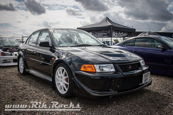 A Black Mitsubishi Lancer Evo VI TME X527AHY