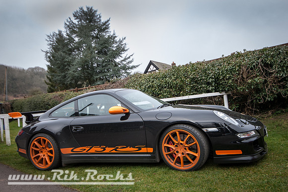 A Black and Orange Porsche 911 GT3 RS